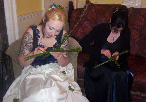 Bride and Maid making 
Cross as part of reception Entertainment